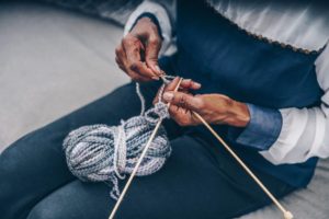 senior knitting yarn hands