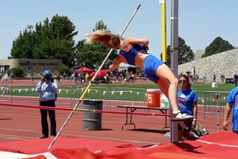 Pole vaulter clearing the bar